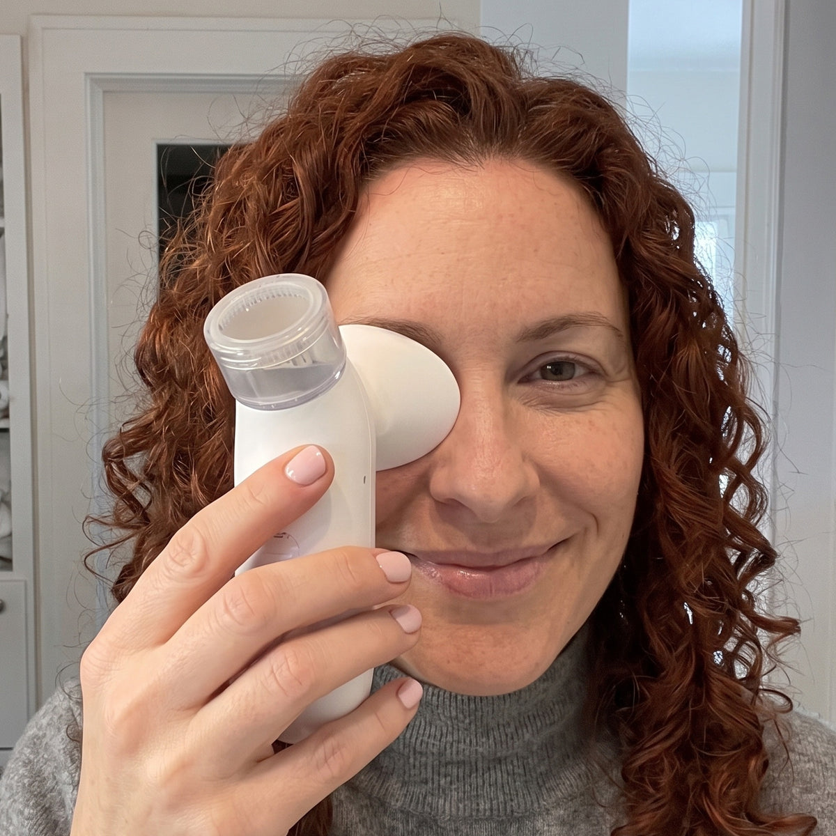 Woman relaxing with the eye steamer in the evening